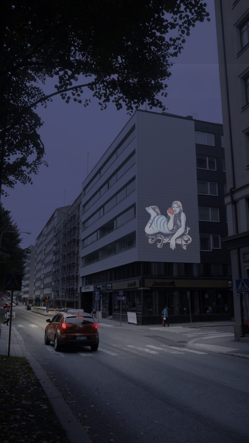 Valogallerian teos heijastettuna kerrostalon seinään.